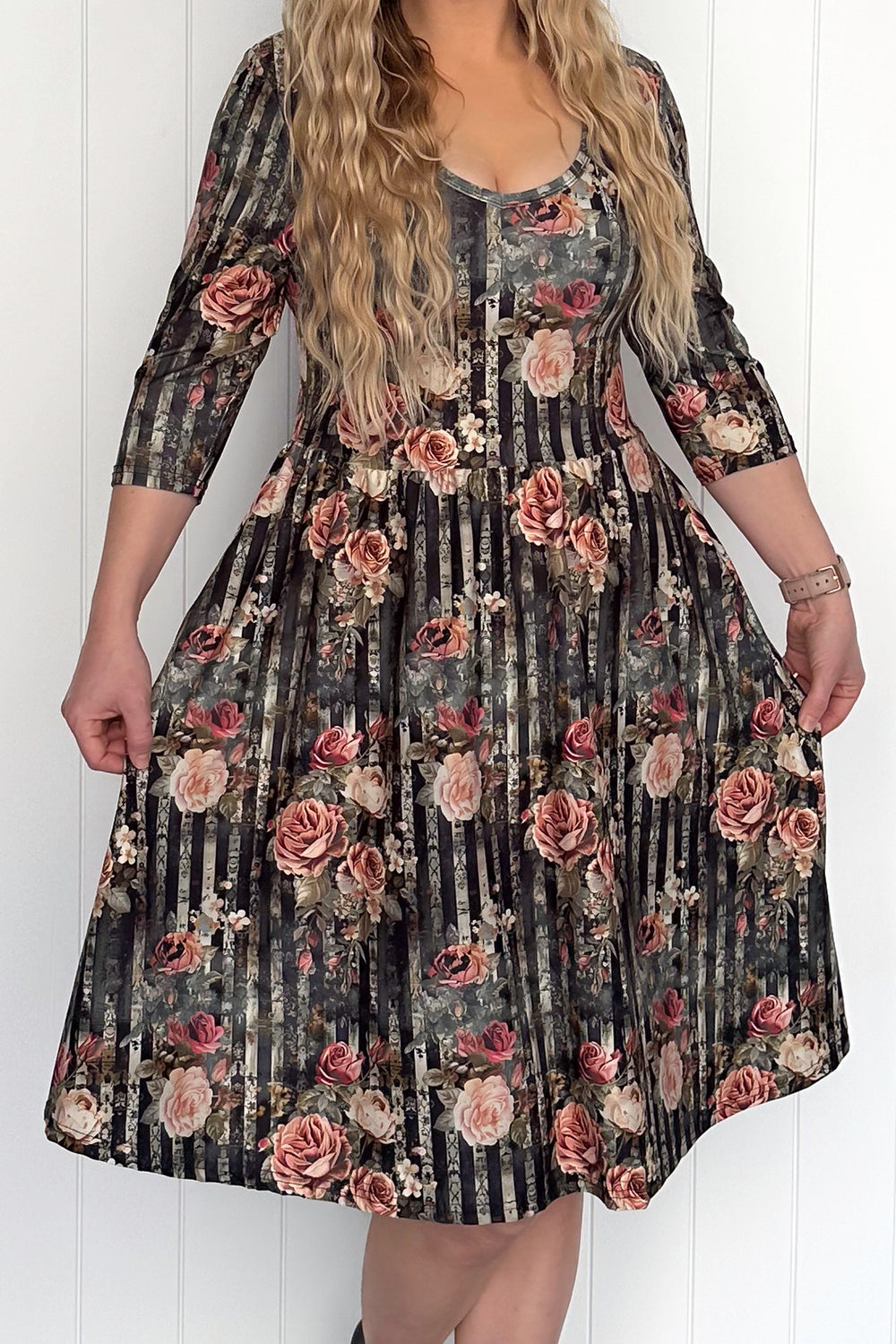 Woman wearing a floral dress with a white background